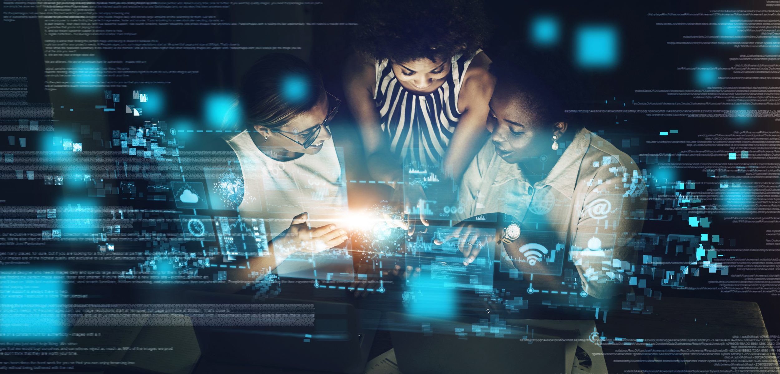 Three women collaborate around a tablet, with digital graphics and data overlays highlighting technology and innovation.